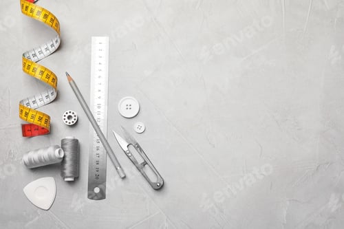 Preview: Sewing Tools and Measurement on Gray Background