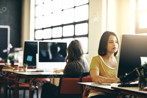 Preview: Cropped shot of a businesswoman working on a computer in an modern office