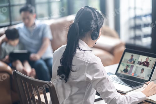 Preview: Asian business woman talking to colleague team about plan in video conference.