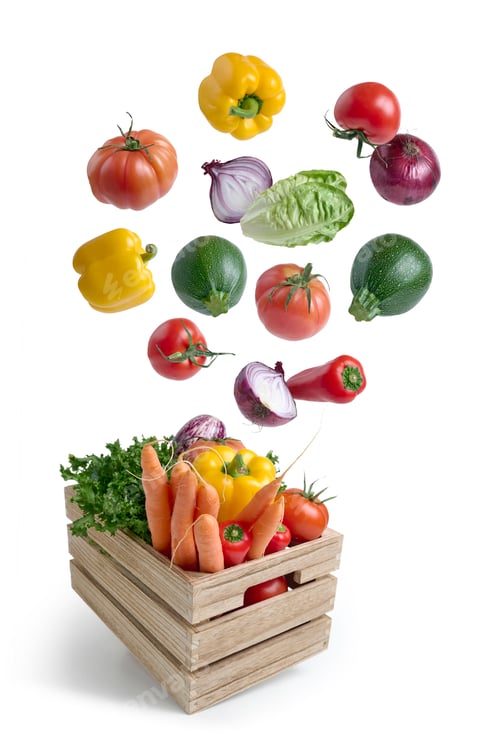 Preview: Fresh vegetables falling into wooden crate on white background