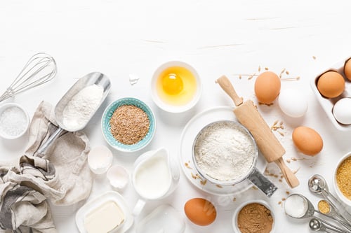 Preview: Baking homemade bread on white kitchen worktop with ingredients for cooking