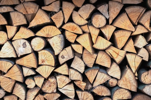 Preview: Split hardwood firewood stacked in a row