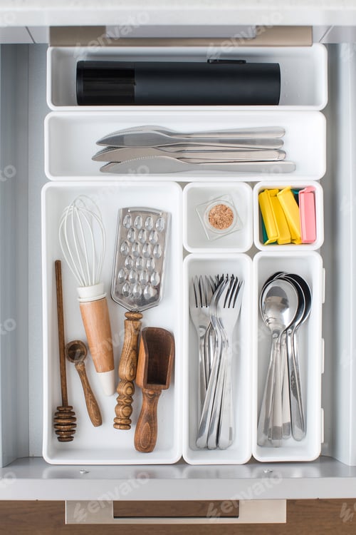 Preview: Organizer trays with a set of cutlery in a drawer in the kitchen. Storage system concept.