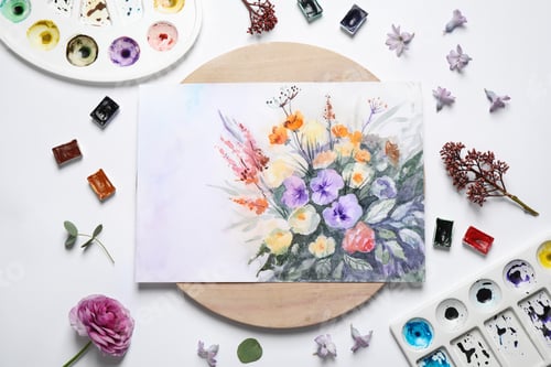 Preview: Flat lay composition with floral picture and watercolor paints on white background