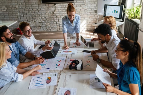Preview: Group of multiethnic business people brainstorming, analyzing financial reports in office