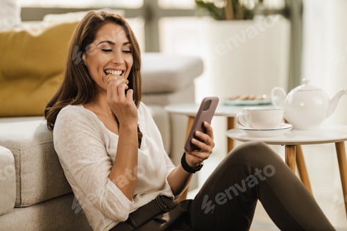 Preview: Woman Using Smartphone At Home