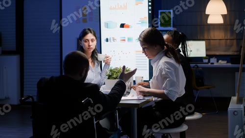 Preview: Selective focus of disabled paralyzed businessman in wheelchair explaining company strategy