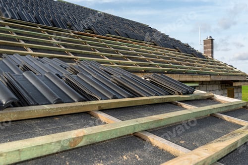Preview: Roof ceramic tile arranged in packets on the roof on roof battens. laying tiles on a boarded roof.