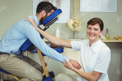 Preview: Physiotherapist giving arm massage to a patient