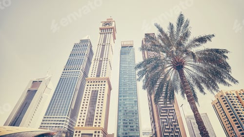 Preview: Retro stylized panoramic photo of Dubai skyscrapers with a palm