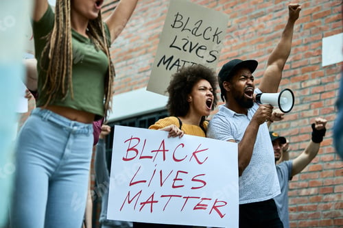 Preview: Below view of African American couple participating in black civil rights demonstrations.