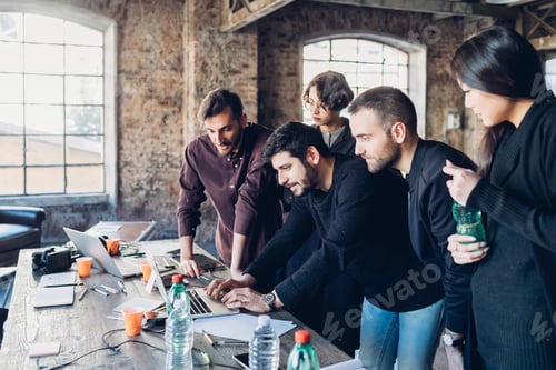 Preview: Designer showing presentation to colleagues in studio