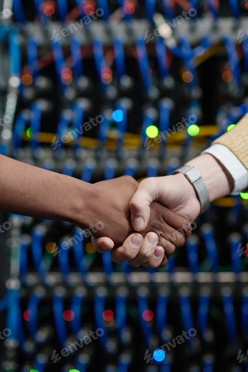 Preview: Server engineers shaking hands at office