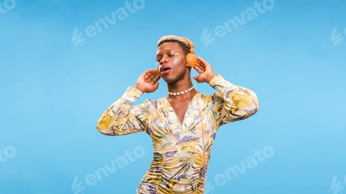 Preview: African American gay person listening to music