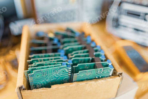 Preview: Close-up electric green embedded microcircuits in production