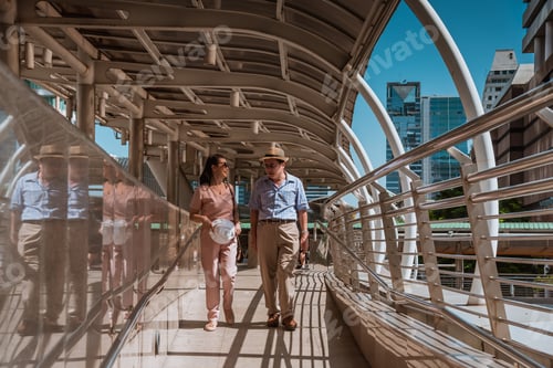 Preview: Tourist woman and oldest man wearing casual dress ,hand holding baggage for travel walking and talki