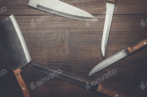 Preview: kitchen knifes on brown wooden table background