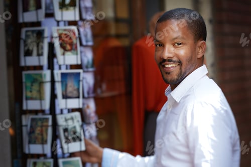Preview: Portrait of Young smiling african-american man wearing informal clothes outside.