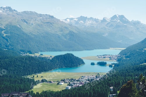 Preview: Aerial view to the city St. Morirz and lake, on sunny summer day, overlook of Engadin valley in