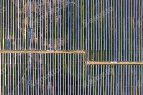 Preview: Solar energy farm. High angle, elevated view of solar panels on an energy farm