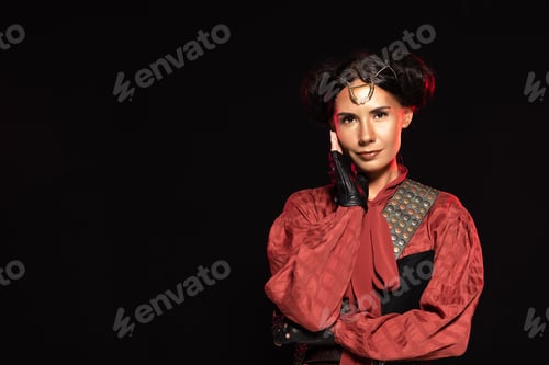 Preview: front view of attractive smiling steampunk woman in leather gloves isolated on black