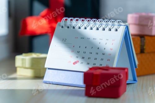 Preview: A December desk calendar highlighting Christmas and Boxing Day is surrounded by colorful gift boxes