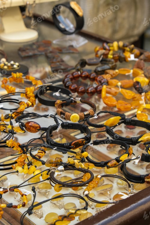 Preview: Colorful showcases of traditional jewelry stores and amber gemstone products in city market square