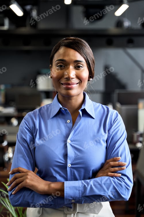 Preview: Confident young African American business woman leader in office, portrait.