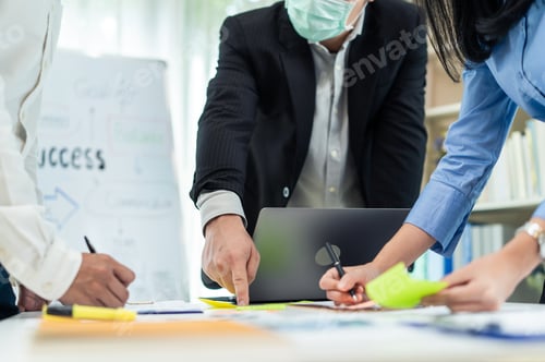 Preview: Group of Business people wear mask due to Covid19, meeting in office.