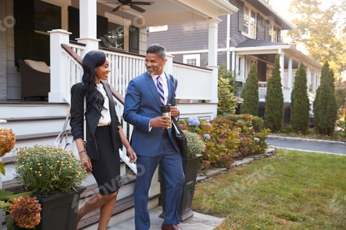 Preview: Business Couple Leaving Suburban House For Commute To Work
