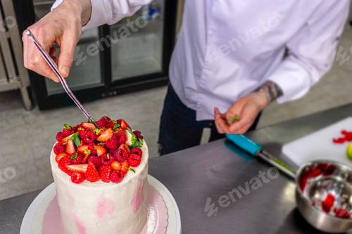 Preview: Colombian Pastry Chef. Male chef decorating with tongs.