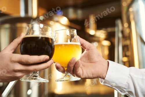 Preview: Two glasses of dark and light beer close up