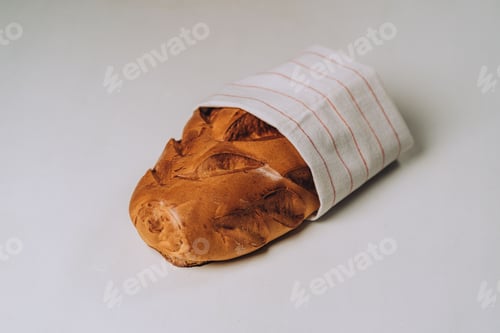 Preview: Closeup of sweet bread loaves on a white surface