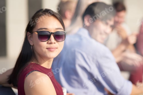 Preview: Pleasant woman in sunglasses enjoying warm weather