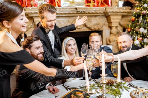 Preview: Elegantly dressed people celebrating New Year holiday indoors