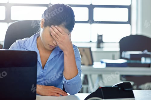 Preview: Shes not handling the pressures of her job. Shot of a businesswoman experiencing stress at work.