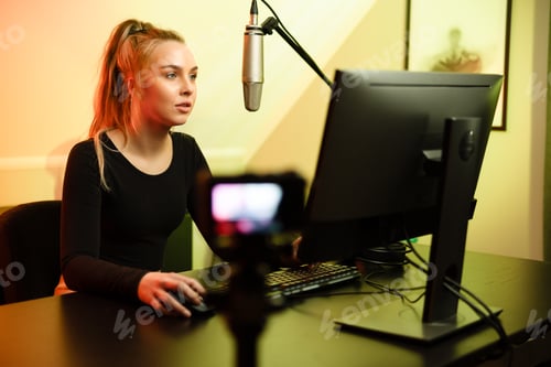 Preview: Professional esport gamer girl streaming vlog and plays online video game on PC