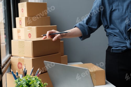 Preview: Asian small business owner working at home office. Business retail market and online sell marketing