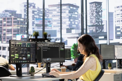 Preview: Employee conducting code review to fix bugs in machine learning company software.