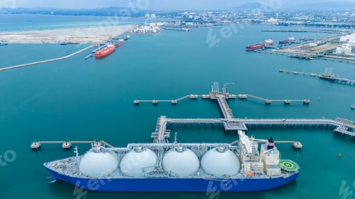 Preview: LNG (Liquified Natural Gas) tanker anchored in Gas terminal gas tanks for storage. Oil Crude