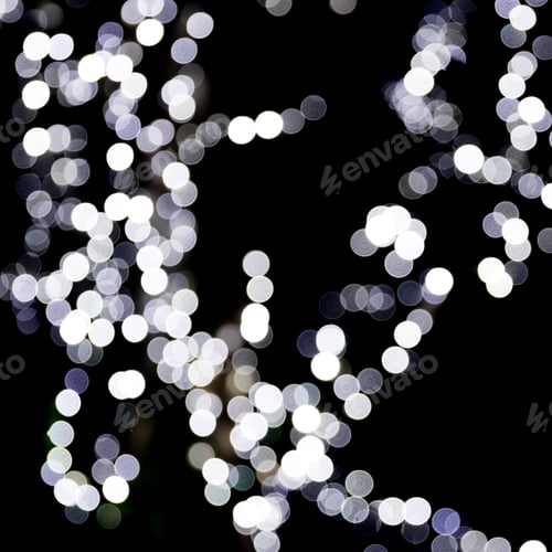 Preview: Abstract bokeh of white city lights on black background. defocused and blurred many round light