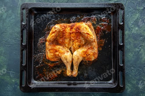 Preview: top view delicious baked chicken with spices on dark-blue background spicy pepper meat bird dish