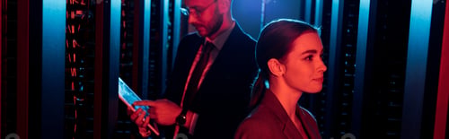Preview: panoramic shot of attractive businesswoman near businessman with digital tablet in data center