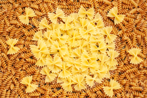 Preview: High resolution photo of various kinds of raw Italian pastas arranged in a circle in overhead view