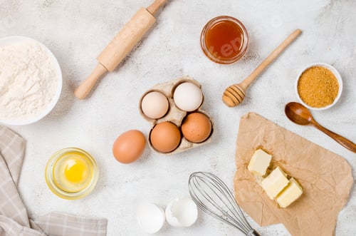Preview: Ingredients for making dough dishes: cakes, cookies, muffins, pies on a gray background.