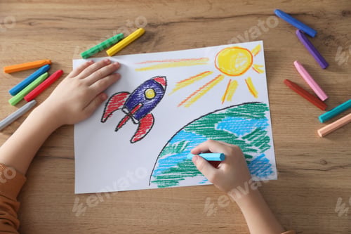 Preview: Little girl drawing picture with soft pastel at wooden table, top view. Child`s art