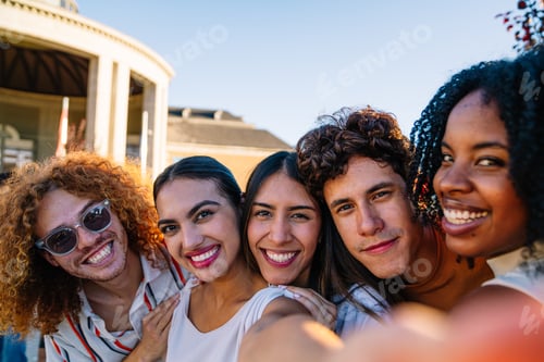 Preview: Happy students smiling and taking selfie outdoors together