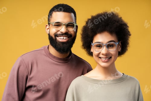 Preview: Portrait of smiling, happy African American man and woman wearing eyeglasses, looking at camera
