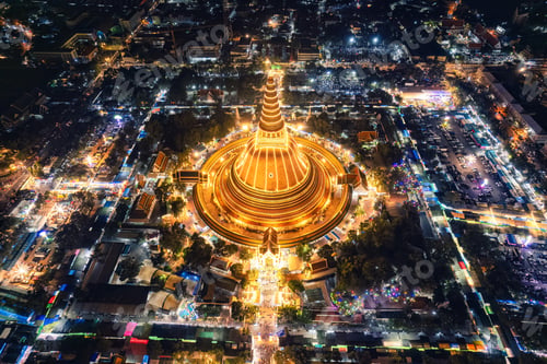 Preview: Majestic golden pagoda of Phra Pathom Chedi glowing among the festival lights