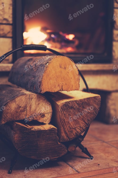 Preview: Firewood and burning fireplace at home